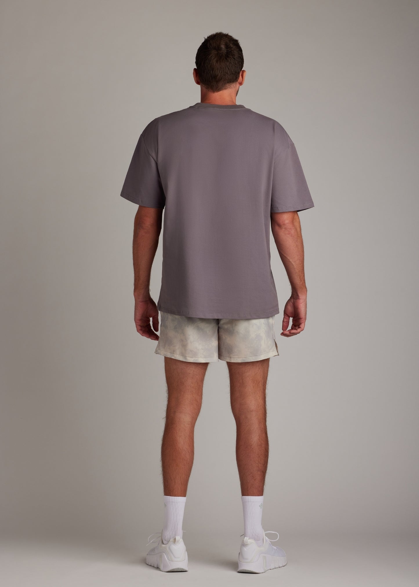 Cream Smoke active shorts with hyper-breathable fabric, ideal for running and training.