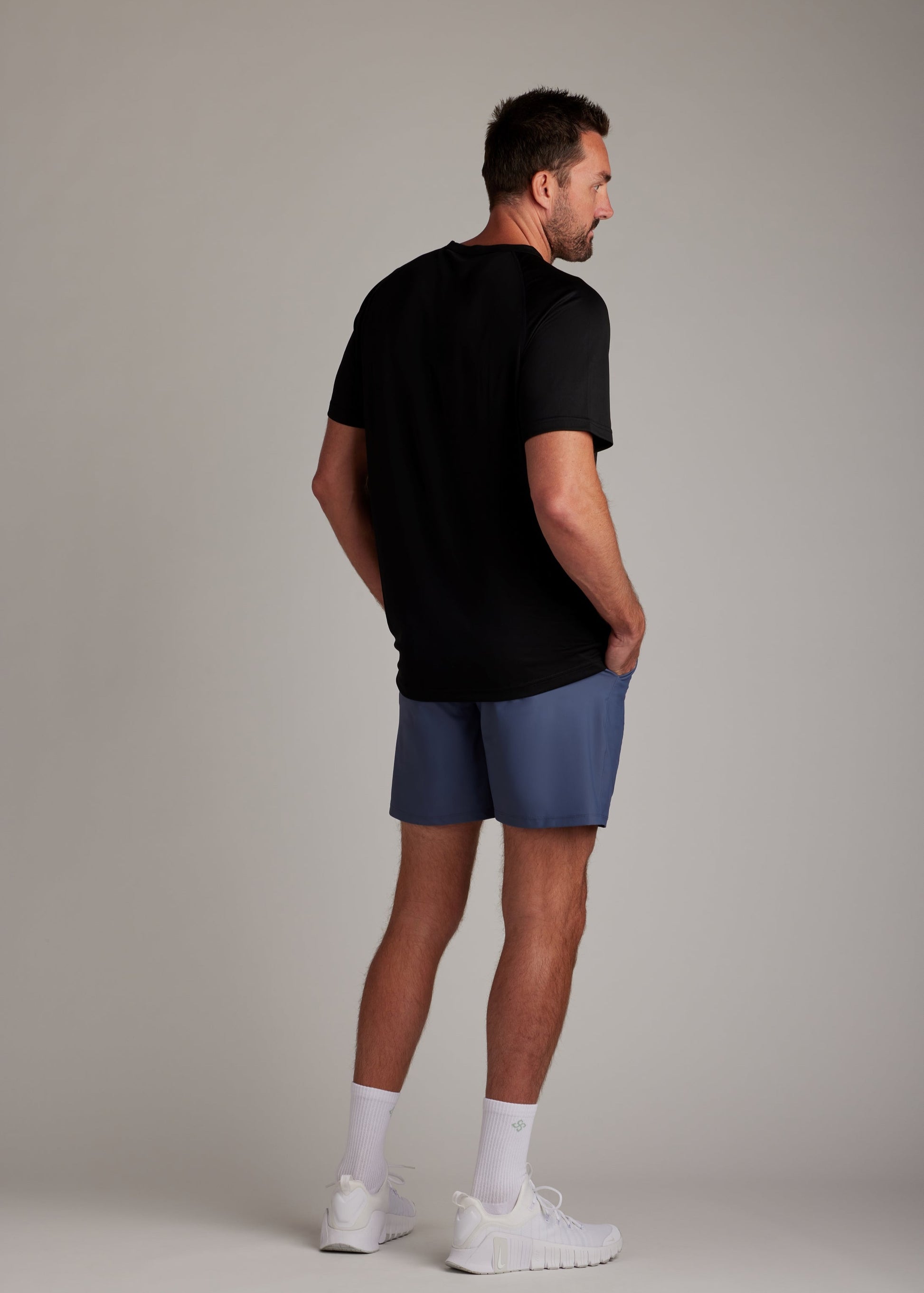 Black 3-button polo shirt crafted from breathable micro-mesh fabric for active sports.