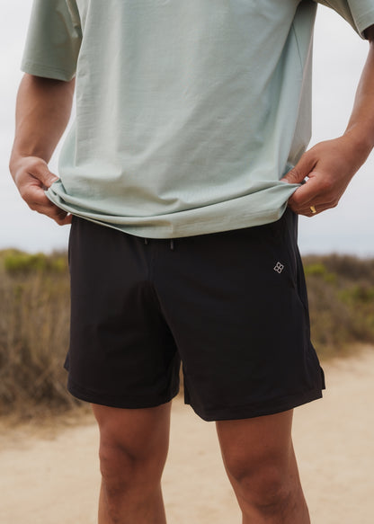 Black hyper-breathable active shorts with elastic drawstring waistband for running and training.