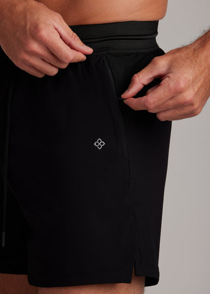Black hyper-breathable active shorts with elasticated drawstring waistband, versatile for running and training.