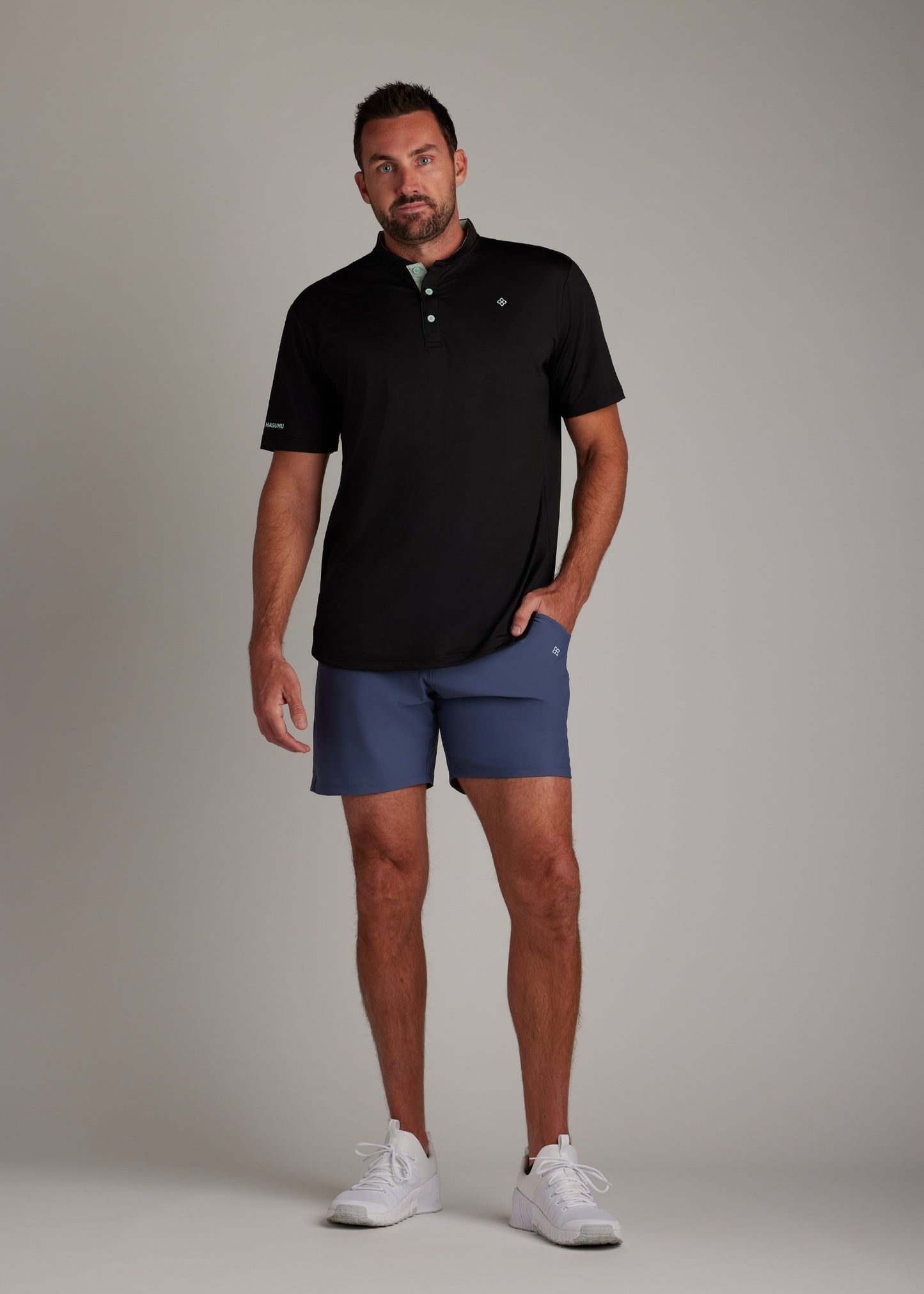 Black bladed collar polo shirt combining functionality and a modern aesthetic.