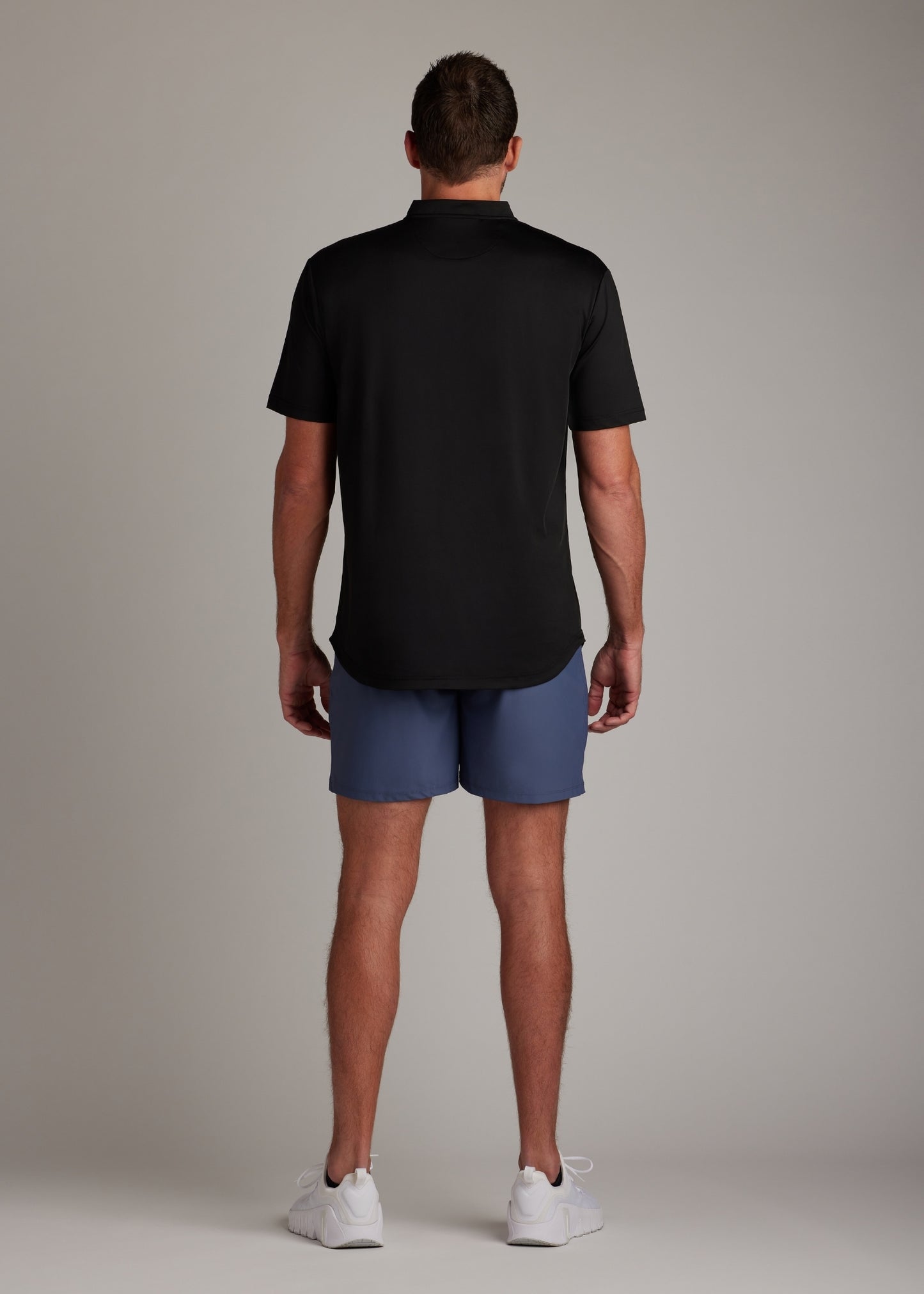 Black bladed collar polo shirt crafted from sleek performance fabric for modern style.