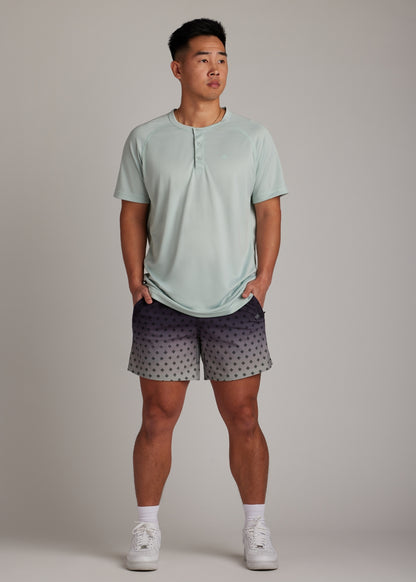Black Fade active shorts made from versatile fabric, featuring zippered pockets.