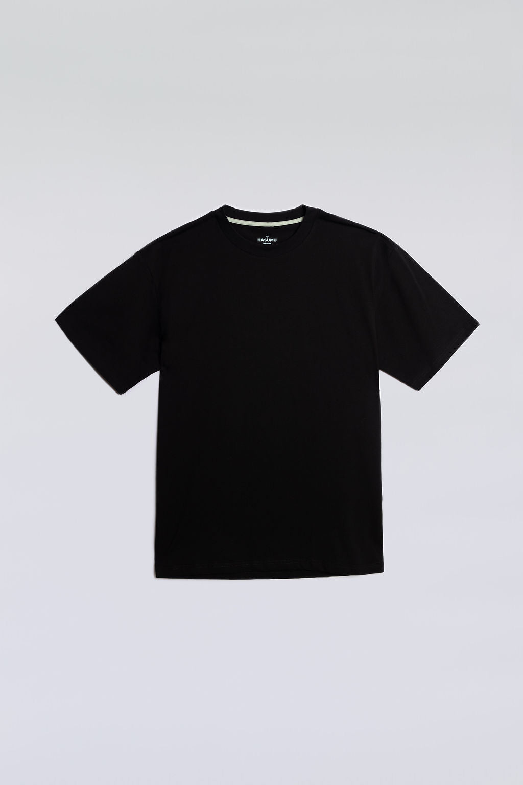 Black oversized tee made from soft, breathable fabric for everyday comfort.