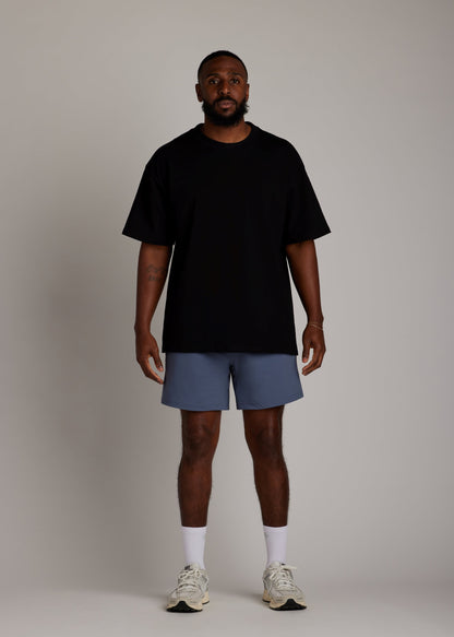 Black oversized tee made from soft, breathable fabric for everyday comfort.