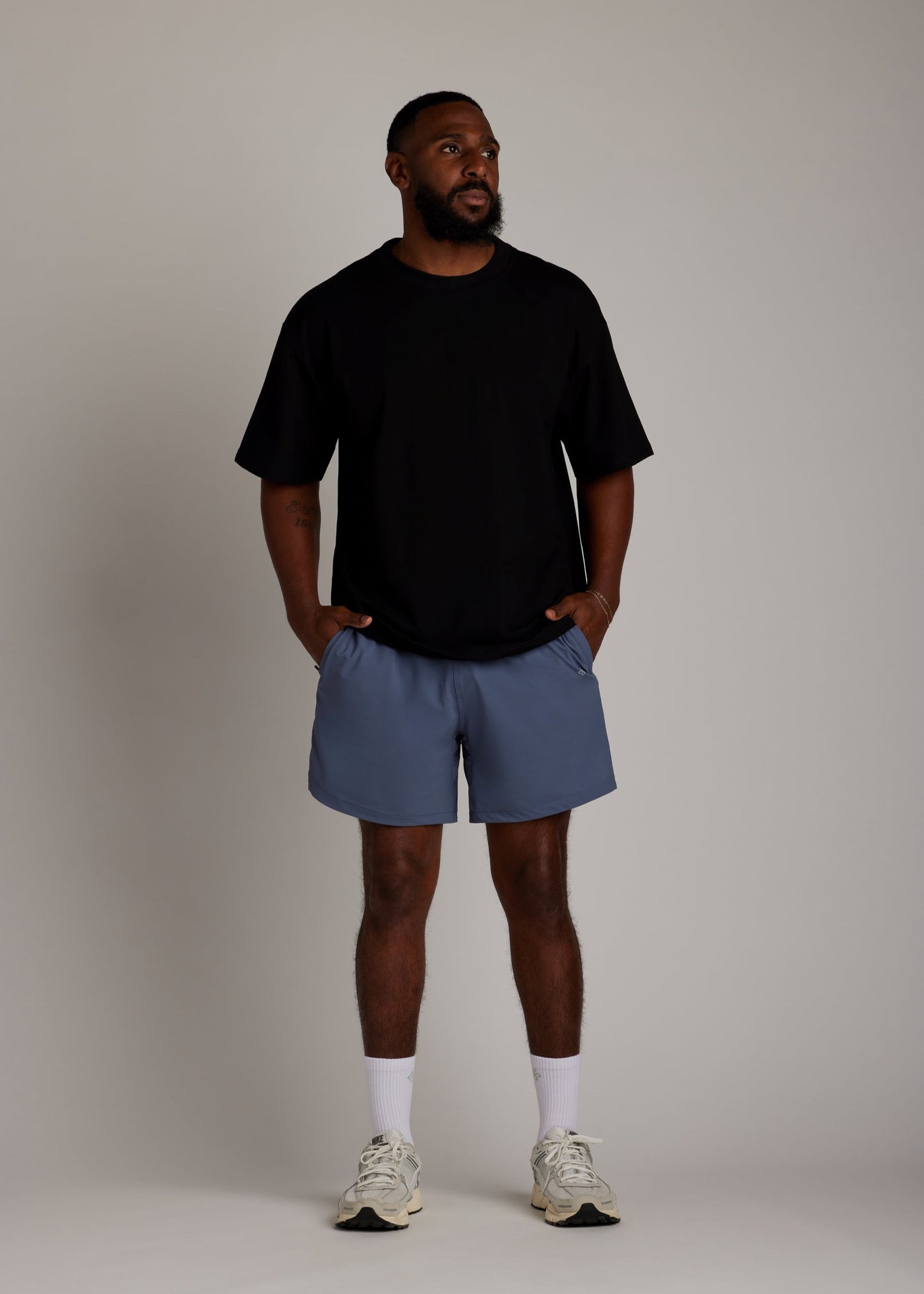 Black oversized tee made from soft, breathable fabric for everyday comfort.