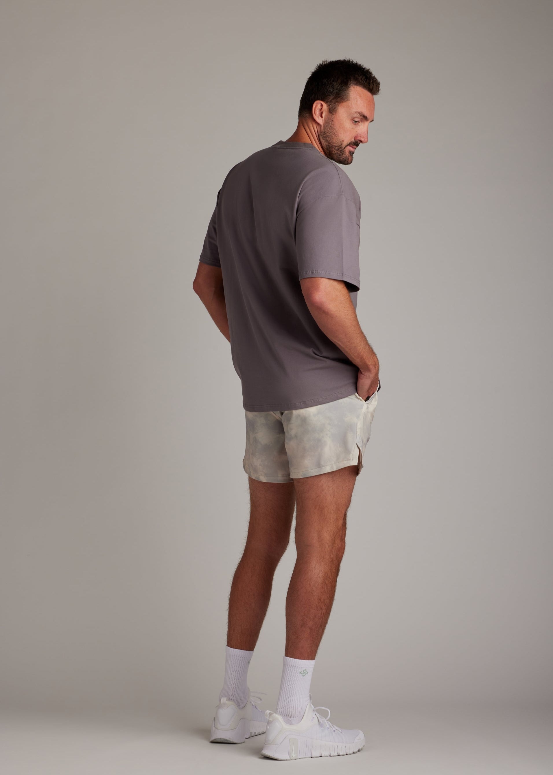 Comfortable charcoal oversized tee in a soft, breathable blend, ideal for laid-back days.