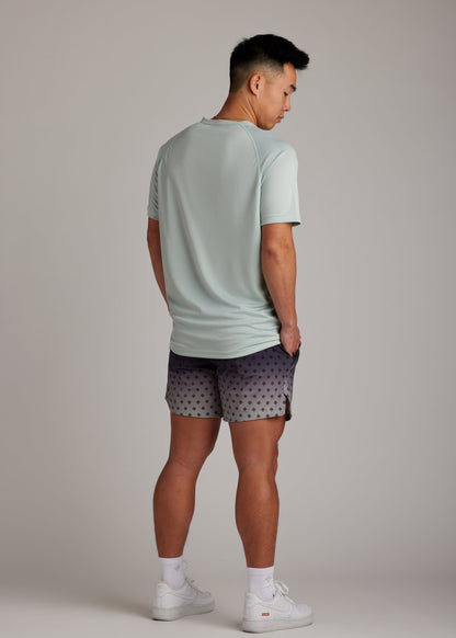 Green 3-button polo tee with modern sport collar, breathable micro-mesh for active wear.