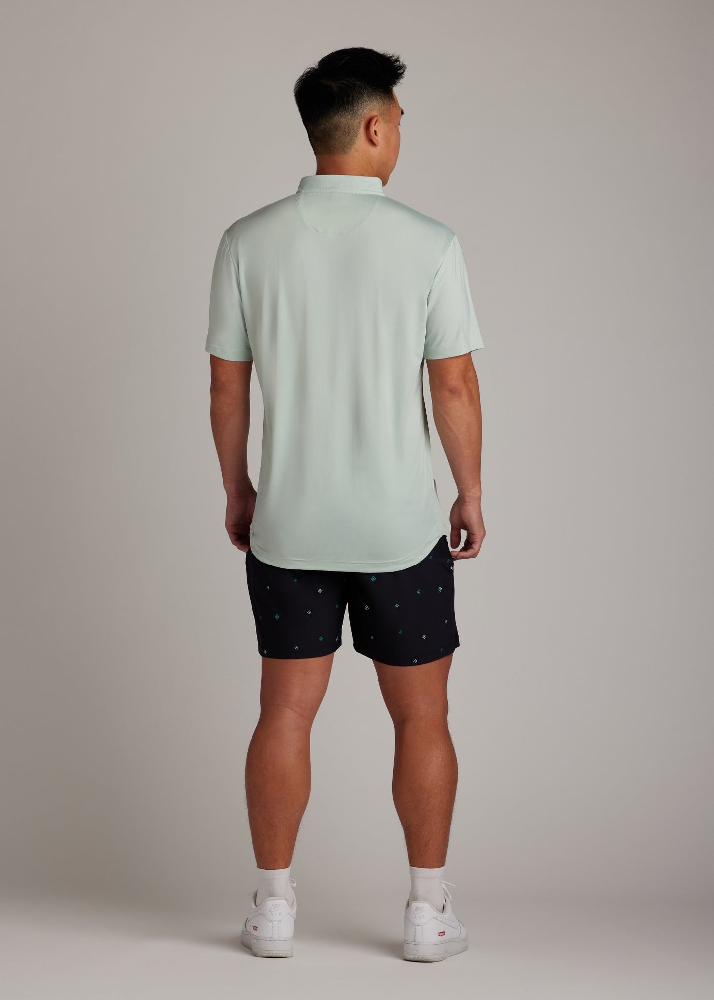 Green bladed collar polo shirt, crafted for style, performance, and comfort.