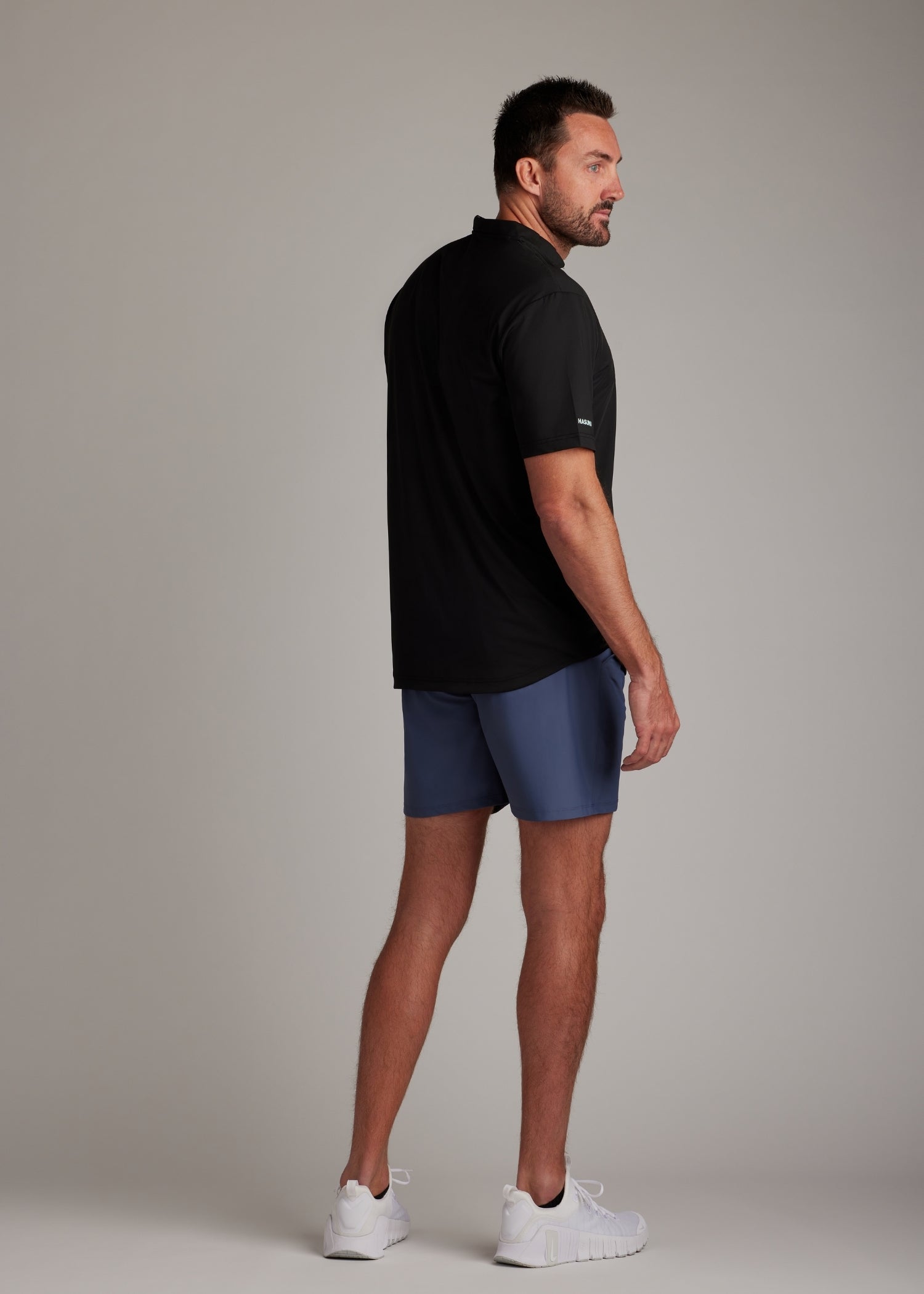 Indigo performance golf walk shorts featuring ultra-lightweight four-way stretch fabric for modern athletes.