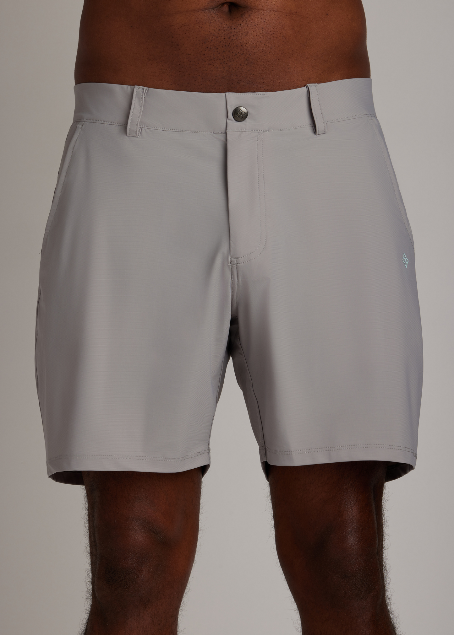 Light grey golf walk shorts crafted from ultra-lightweight, four-way stretch fabric.