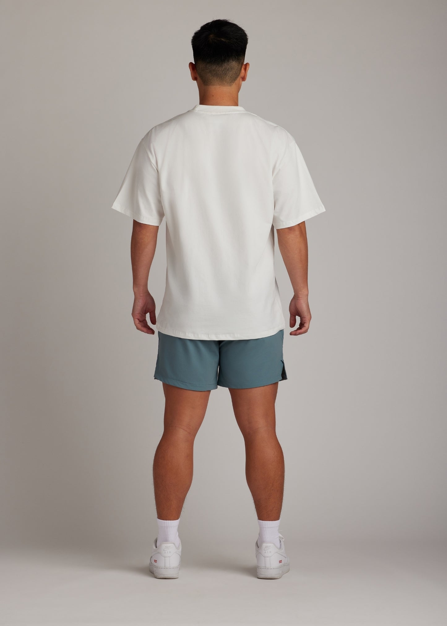 Midnight emerald active shorts, hyper-breathable for running, training, and everyday athleisure wear.