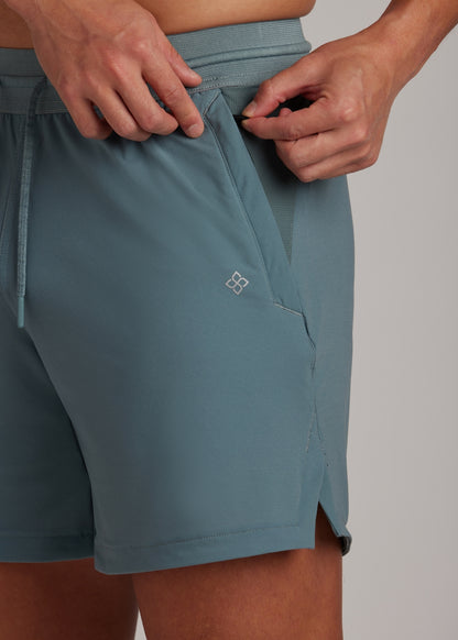 Midnight emerald active shorts for men, hyper-breathable fabric, perfect for training and casual wear.