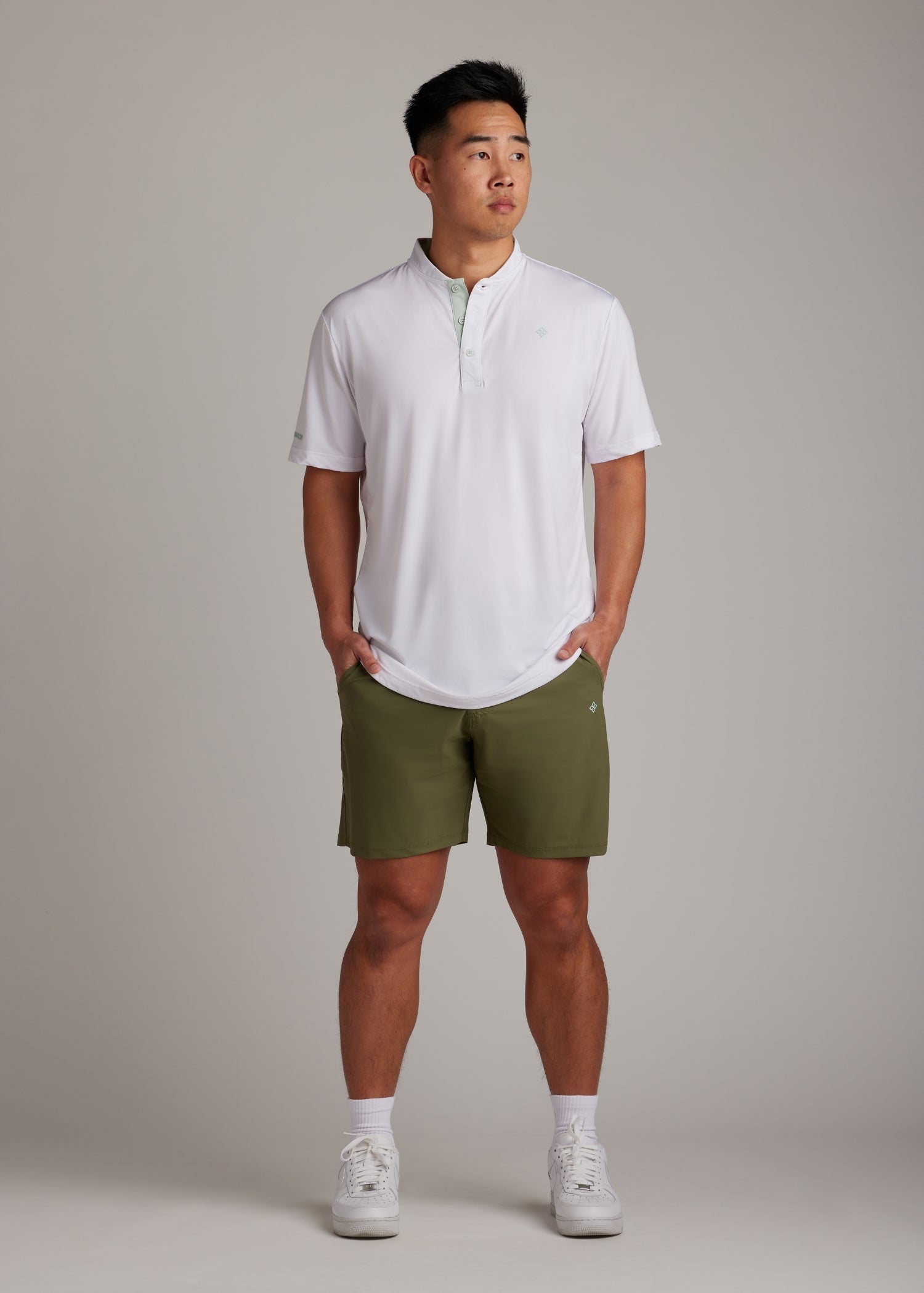 Olive golf walk shorts made from ultra-lightweight, four-way stretch fabric.