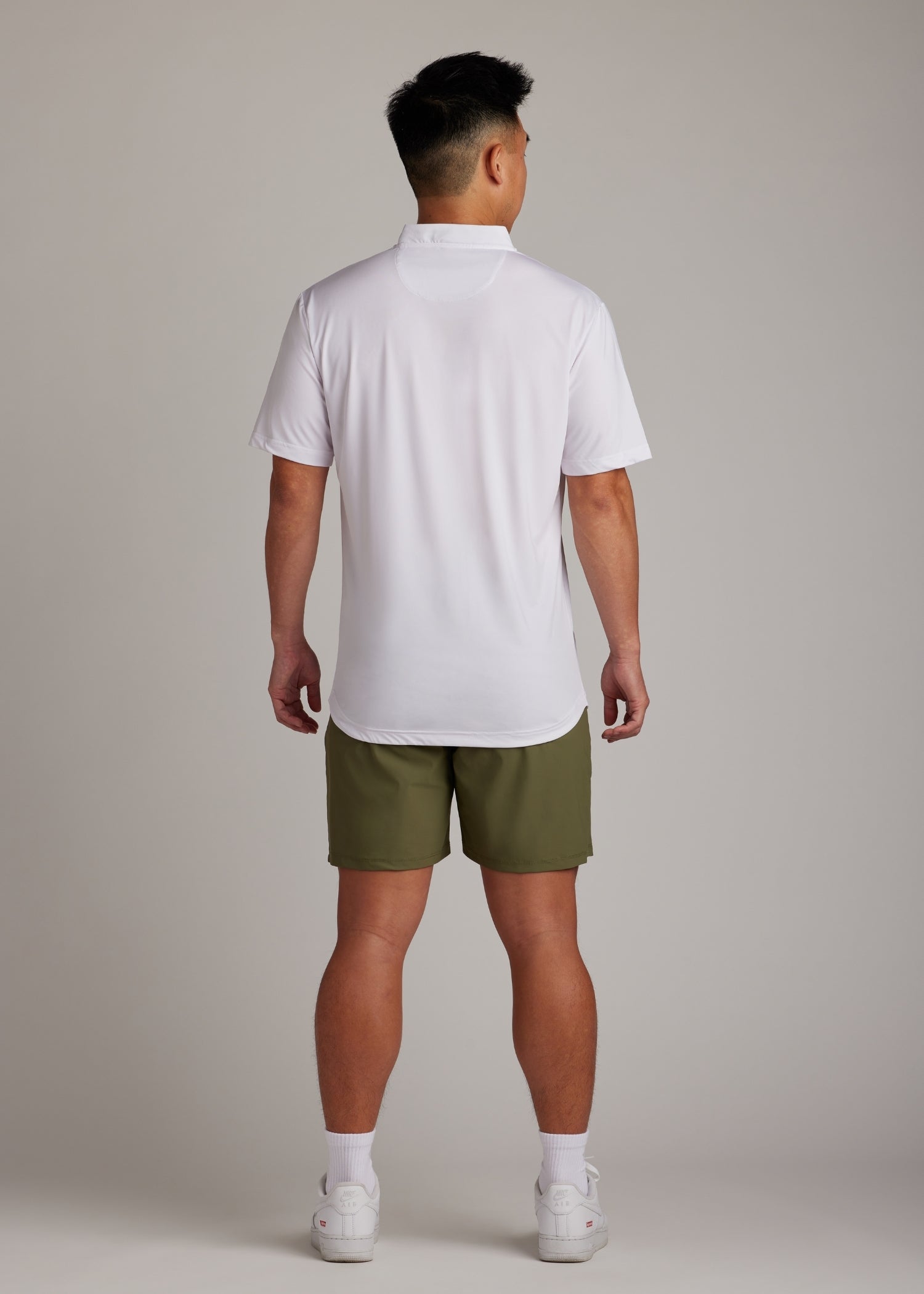 Olive golf walk shorts made from ultra-lightweight, four-way stretch fabric.