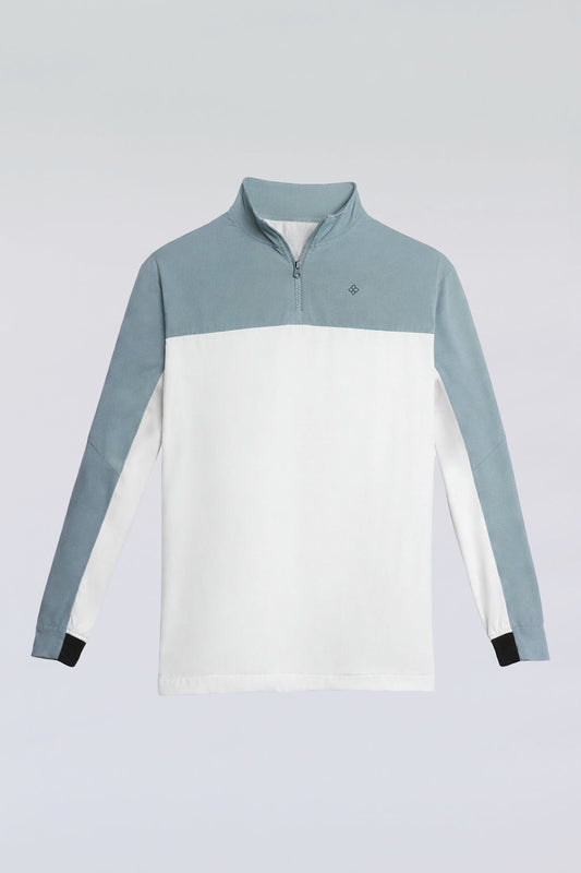 Front view of the Taylor Day greens windbreaker, a lightweight quarter zip.
